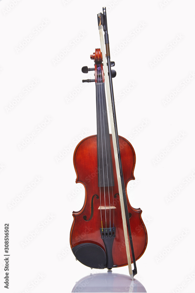 Violin with bow isolated on a white background. Musical concept. Violin with bow isolated on a white background. Musical concept.
