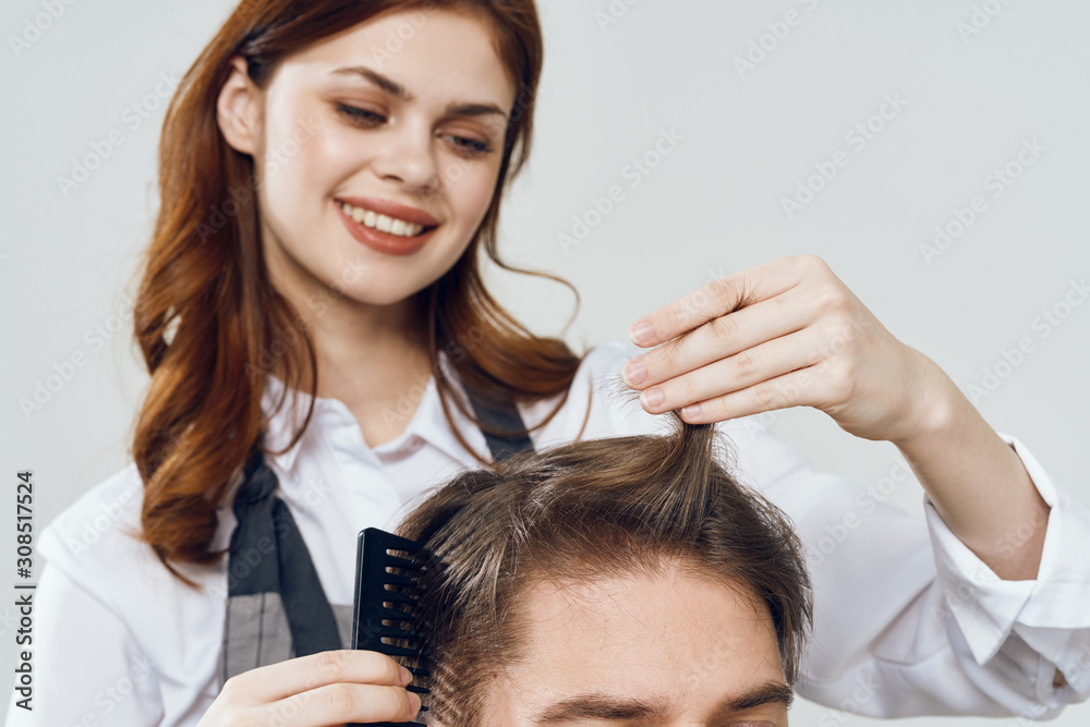 Naklejka premium portrait of young woman applying makeup