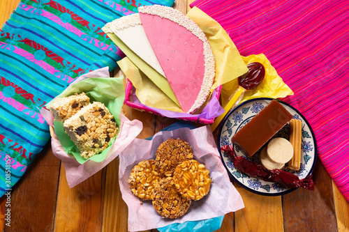 Group of mexican candies on wooden background photo