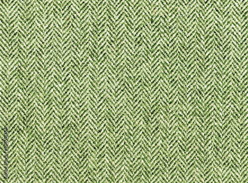 Herringbone tweed, Wool Background Texture. Green grass woolen fabric. Rich tones. Expensive men's suit fabric. High resolution