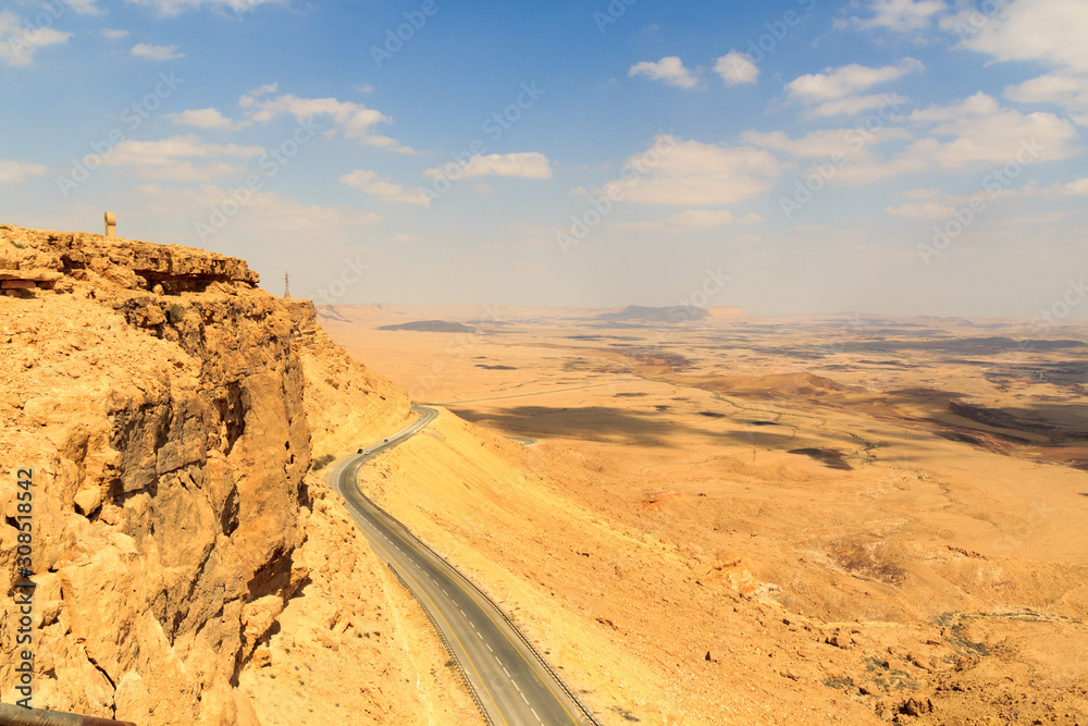 Mountain panorama and street in crater Makhtesh Ramon, Negev Desert, Israel