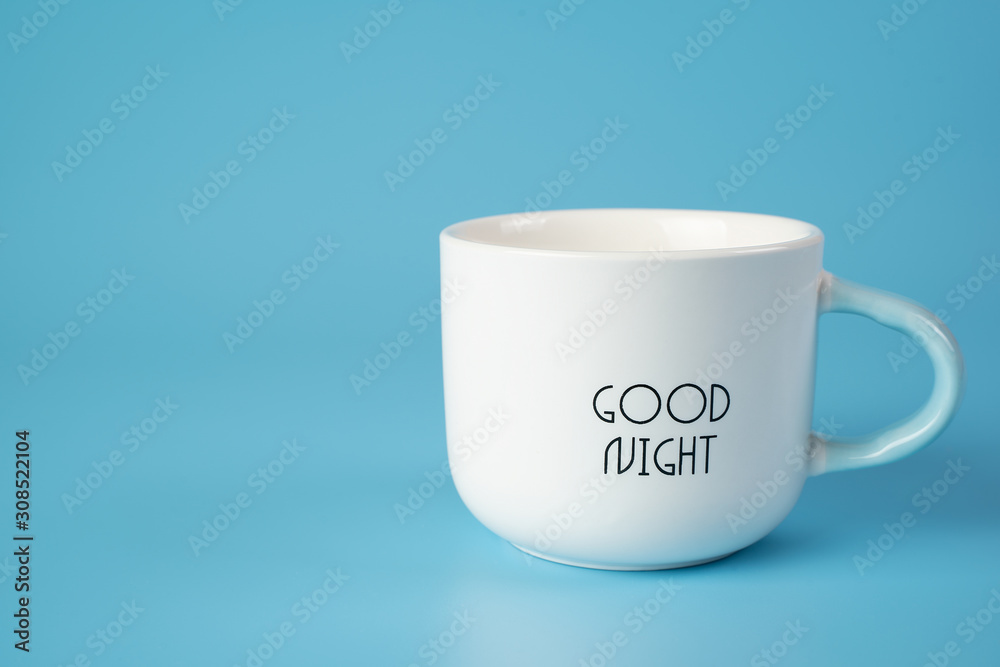 White Cup with inscription on blue background. Conveys freshness, vivacity of spirit. White Cup with inscription on blue background. Conveys freshness, vivacity of spirit.