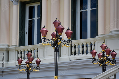 Entrance facade and stairs decorated with beautiful claret, golden and black standing lamps of The Chakri Group (Phra Thinang Chakri Maha Prasat) photo