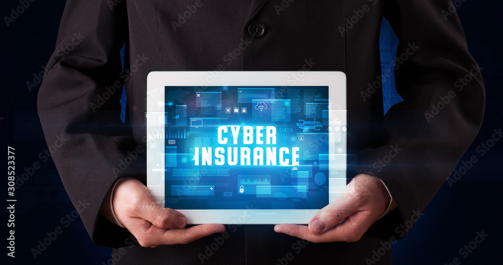 Young business person working on tablet and shows the digital sign: CYBER INSURANCE Young business person working on tablet and shows the digital sign: CYBER INSURANCE