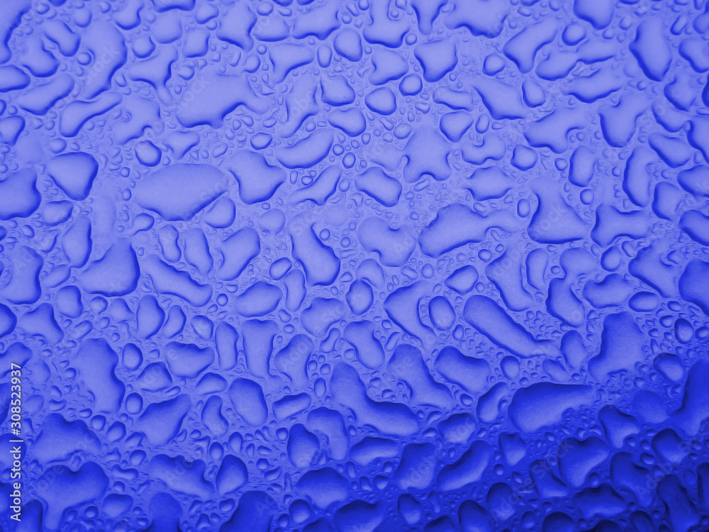 Blurred defocused blue abstract texture dew drops water background.