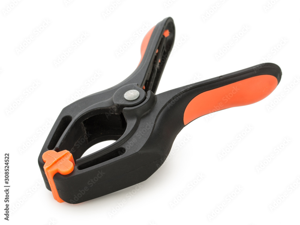 Back plastic spring clamp isolated on a white background. Back plastic spring clamp isolated on a white background.