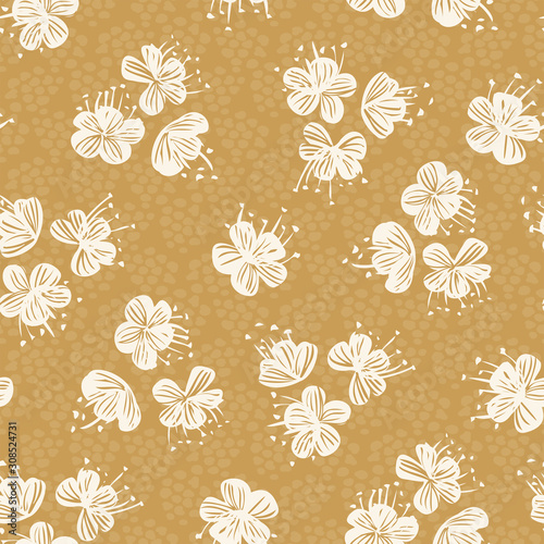 Flower heads in off white tossed around with textured yellow background.