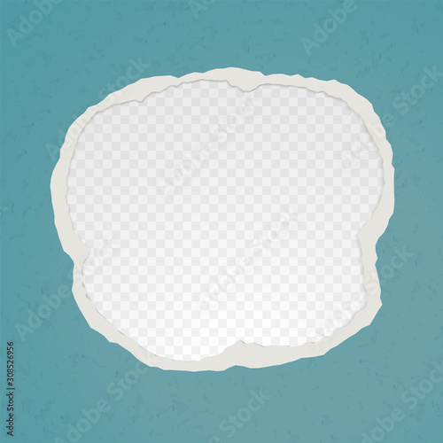 A hole in the ripped recycled paper background. Cardboard or paperboard kraft paper frame
