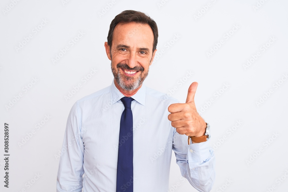 Middle age businessman wearing elegant tie standing over isolated white background doing happy thumbs up gesture with hand. Approving expression looking at the camera showing success. Middle age businessman wearing elegant tie standing over isolated white background doing happy thumbs up gesture with hand. Approving expression looking at the camera showing success.
