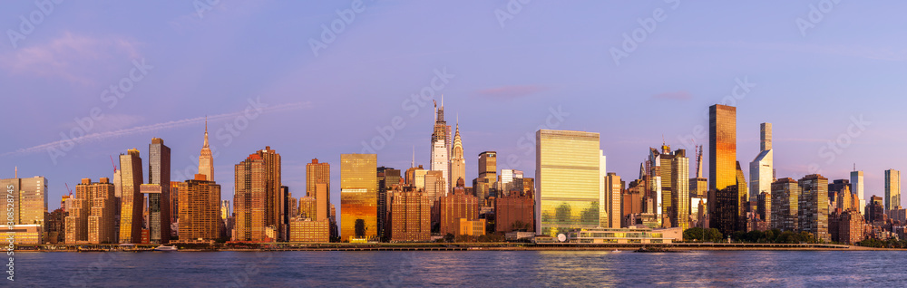 View to Manhattan midtown skyline from Long Island City at sunrise. View to Manhattan midtown skyline from Long Island City at sunrise.