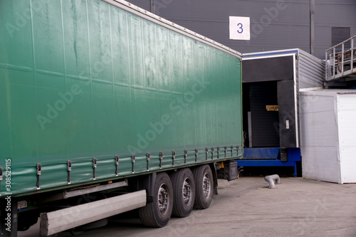 unloading a cargo truck near the gate