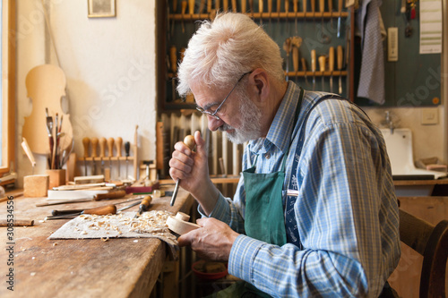 Violin maker at work photo