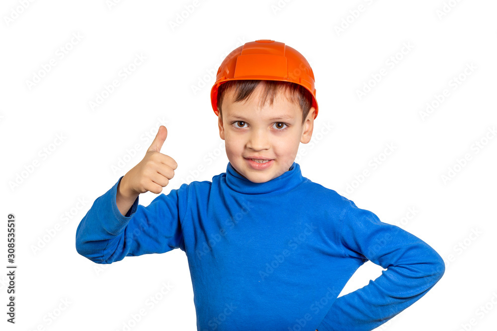 Boy with thumbs up in the protective work hat. Boy with thumbs up in the protective work hat.