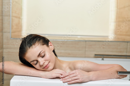 portrait of a woman relaxing in spa