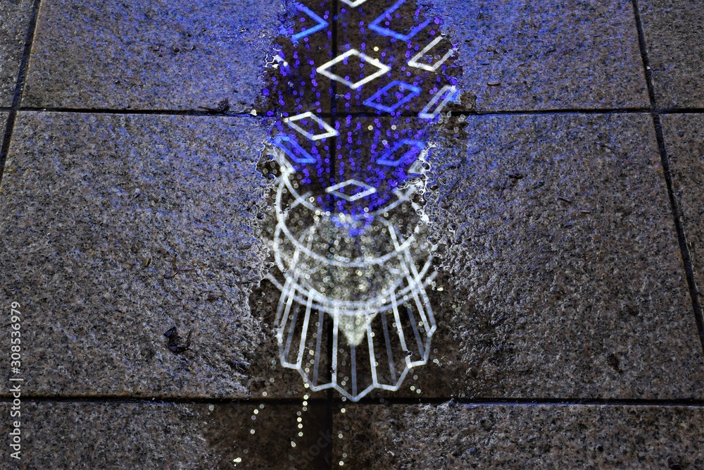 Vilnius Christmas tree reflected in a puddle