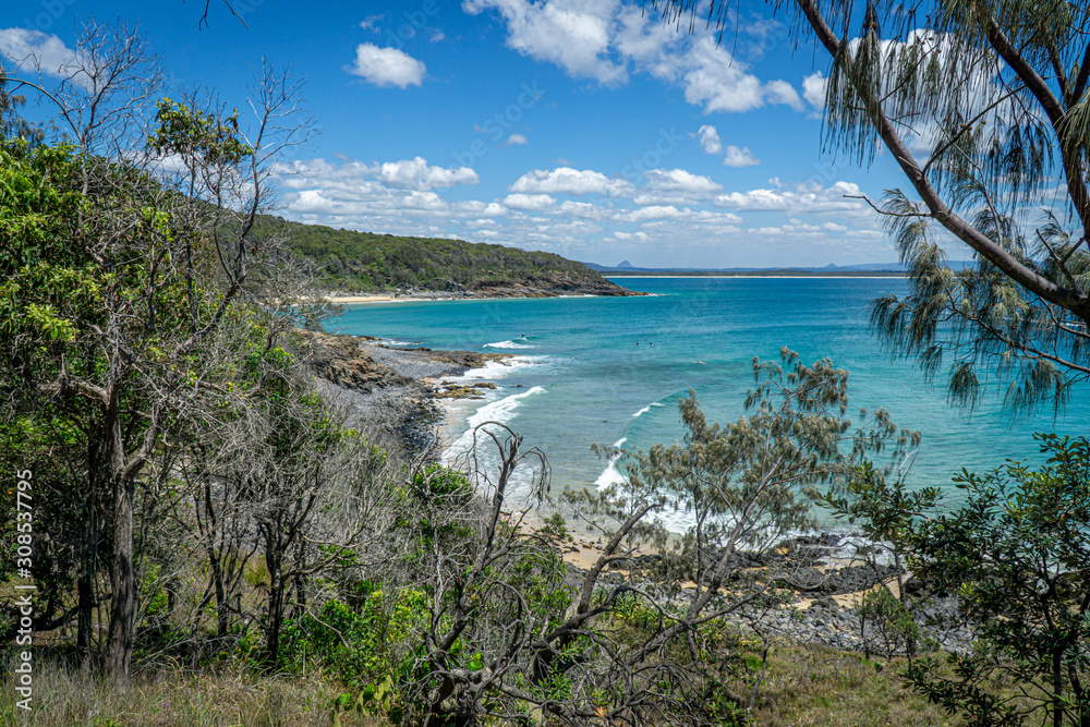 the beautiful beach of Noosa on the sunshine coast in Australia with beautiful weather and blue sky with white clouds