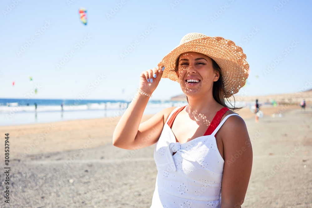 Young beautiful woman smiling happy enjoying summer vacation at the medano beach in Gran Canaria