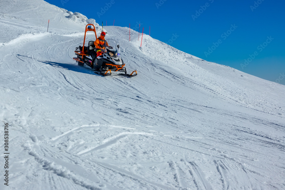 Mountain Rescue Snowmobile on a Ski Slope