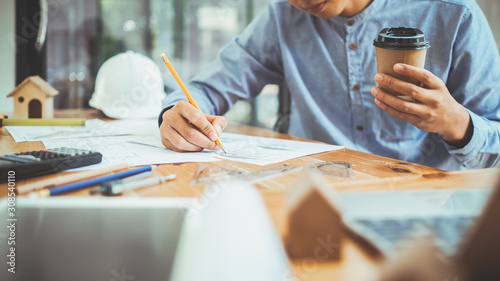 Architect or engineer working in office photo