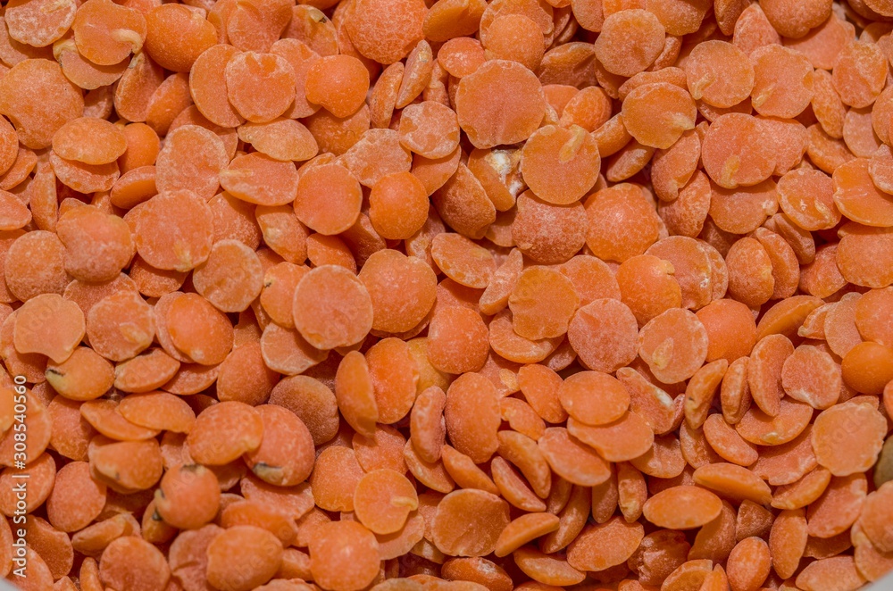Background with red lentils in the foreground Background with red lentils in the foreground