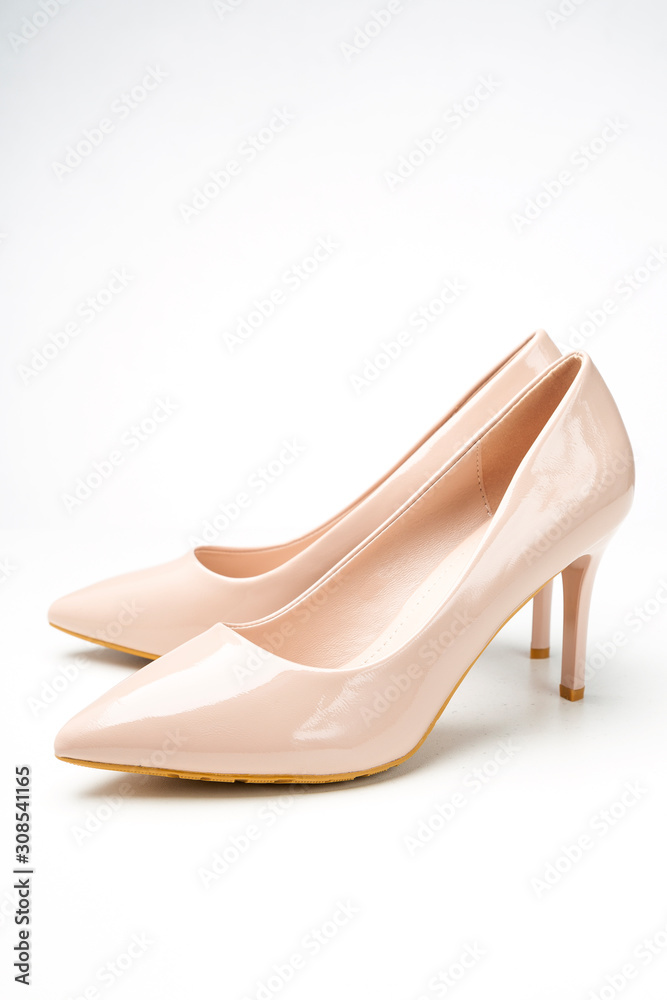 women's patent high heel shoes beige color isolated on white background women's patent high heel shoes beige color isolated on white background