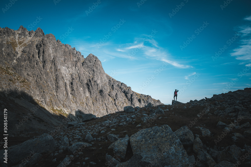 Fototapeta premium silhouette of female hiker. Hiking concept photo
