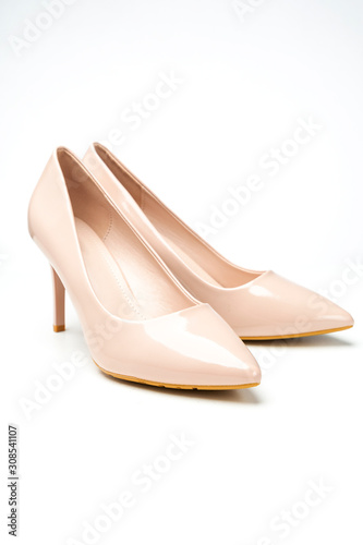 women's patent high heel shoes beige color isolated on white background