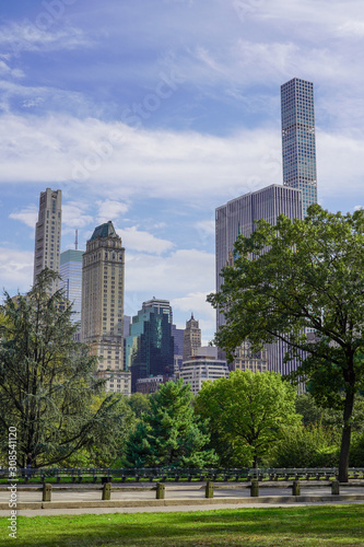 Summer daytime view on sky scrappers from Central Park New York with no people © Tetyana