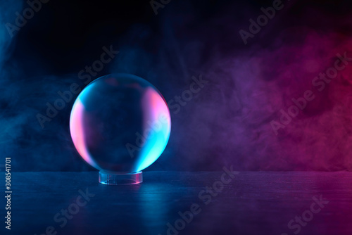 crystal ball in red-blue smoke