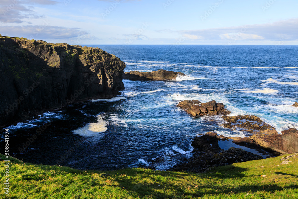 Frothy seas, Eshaness, jagged cliffs, stacks, geos and blow holes, Northmavine, Shetland Isles, Scotland Frothy seas, Eshaness, jagged cliffs, stacks, geos and blow holes, Northmavine, Shetland Isles, Scotland