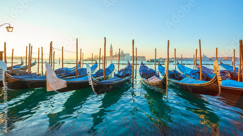 Sunrise at Venice with gondola and island of st george view from the square San marco