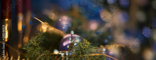 Close up Christmas tree decorated with blue ornaments and lights, xmas decorations. Banner