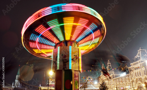Rotating carousel, long exposure carnival ride and Christmas market in Moscow