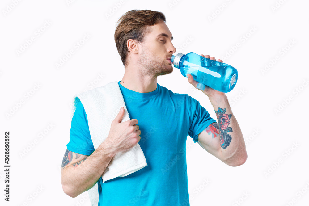 young man with bottle of water young man with bottle of water