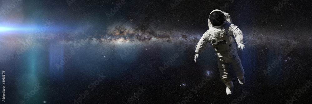 astronaut in front of the Milky Way galaxy