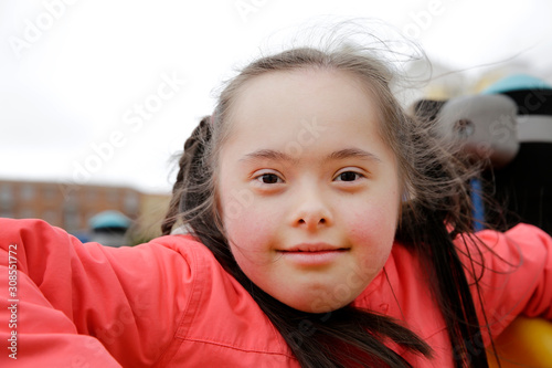 Little girl having fun on the playgound photo