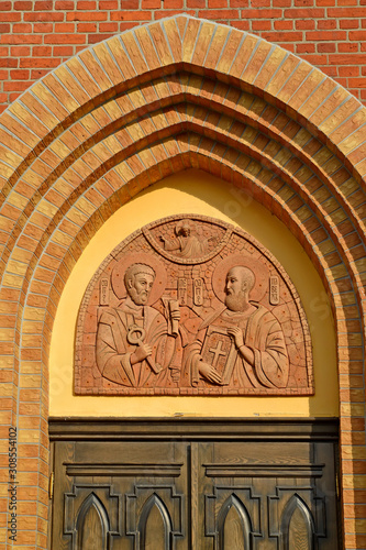 The temple icon above the entrance to the temple of the holy primordial apostles Peter and Paul. Krasnoznamensk, Kaliningrad region