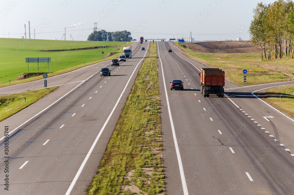 Aerial view of the expressway through the countryside. Beautiful sunny day