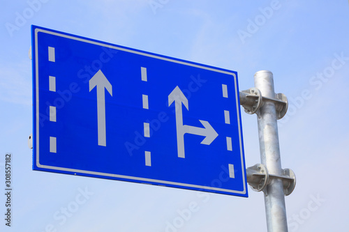 Bild auf Leinwand Blue traffic sign in the sky