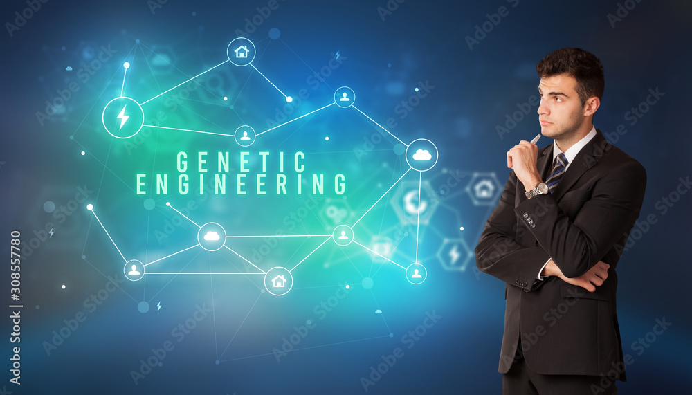 Businessman in front of cloud service icons with GENETIC ENGINEERING inscription, modern technology concept Businessman in front of cloud service icons with GENETIC ENGINEERING inscription, modern technology concept