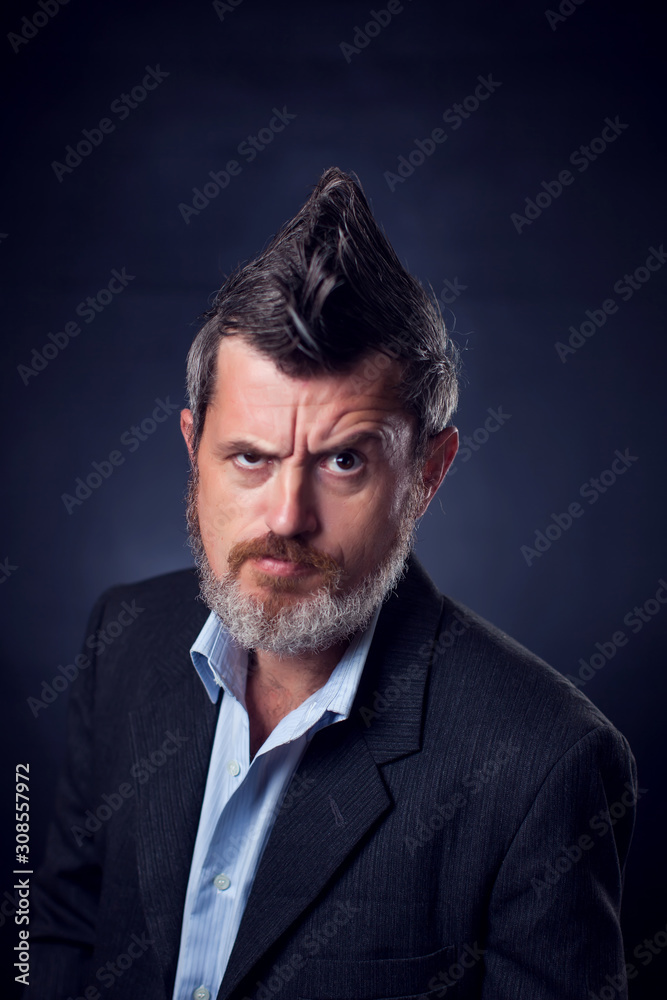 A portrait of bearded man with iroquois wearing suit A portrait of bearded man with iroquois wearing suit