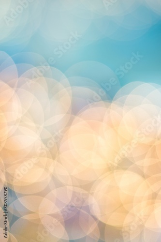 Airy bright abstract color photo, defocused vertical image. Graphic design bokeh lights and sky blue suitable for phone case artwork. © Brett