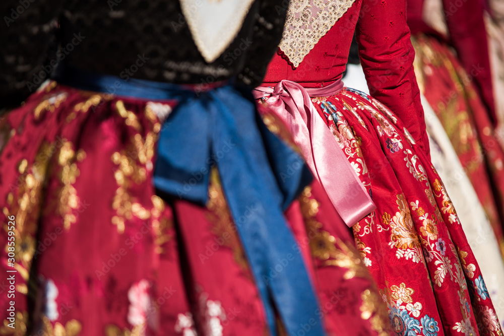 Detail of the typical dress of the fallas of Valencia. Close up photograph focused on one of the skirts with floral motifs.