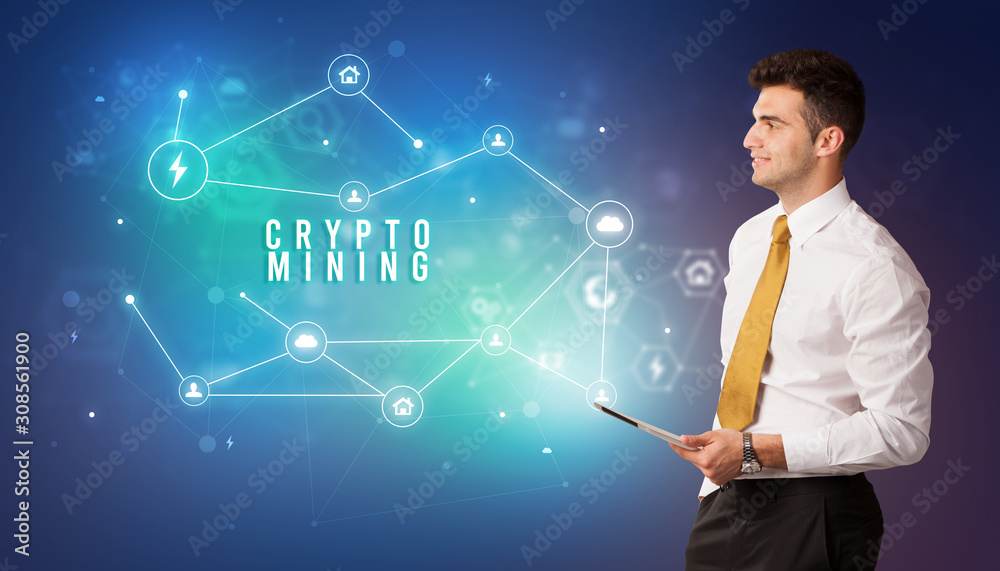 Businessman in front of cloud service icons with CRYPTO MINING inscription, modern technology concept Businessman in front of cloud service icons with CRYPTO MINING inscription, modern technology concept