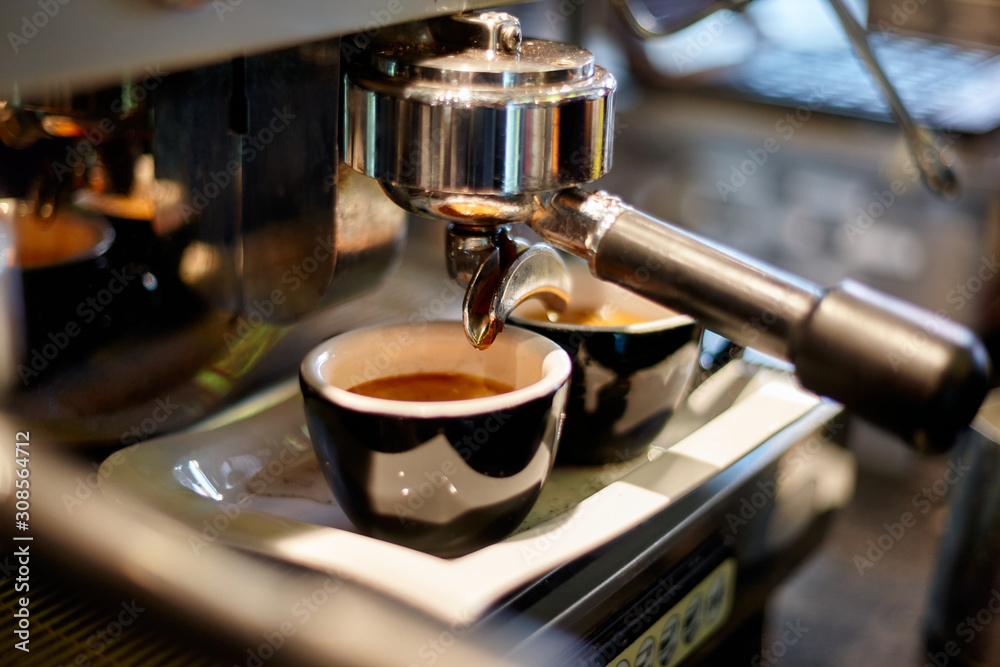 Making coffee in a professional coffee machine in a coffee shop Making coffee in a professional coffee machine in a coffee shop
