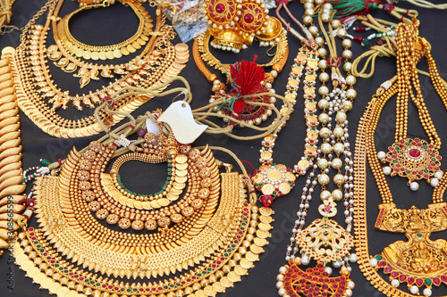 Selected Focus on Golden Jewellery or Jewelry Necklace Garland With Colorful Stones