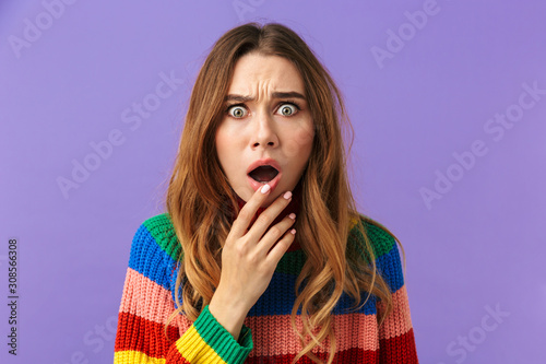 Cute young girl wearing colorful sweater standing isolated