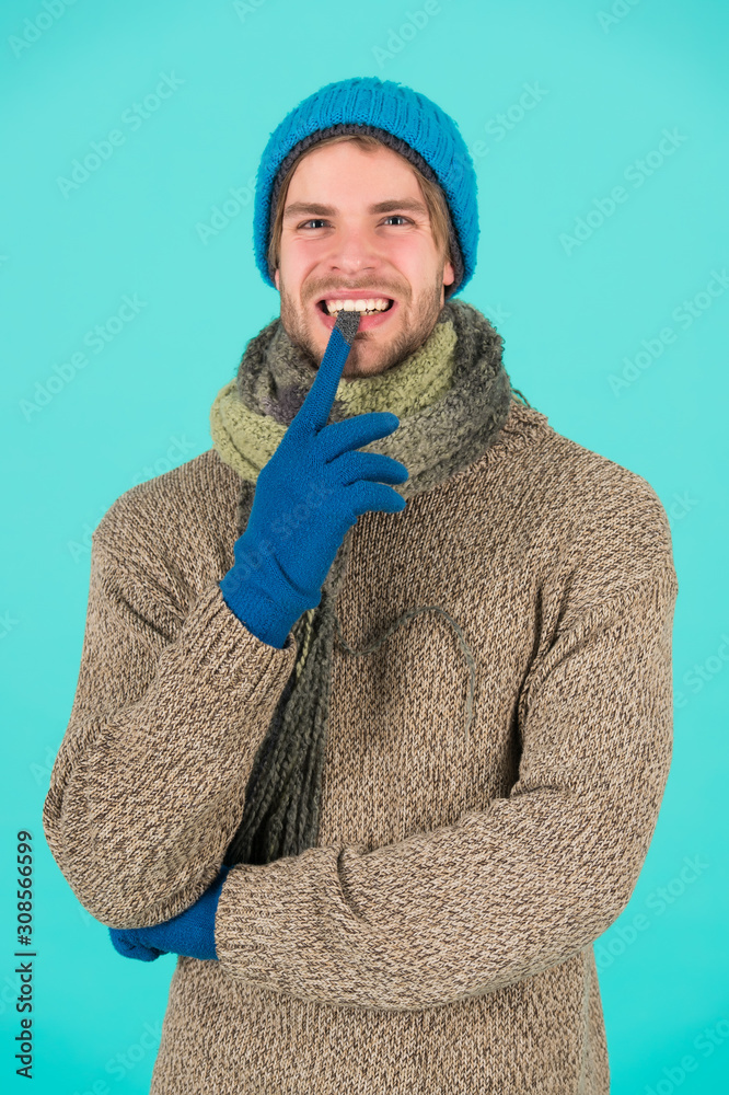 guy feel warm and comfortable. male knitwear fashion. men knitted cloth and  accessory. male blue background. poor homeless man. funny man feeling cold  in winter. no flu. winter weather forecast Stock Photo |