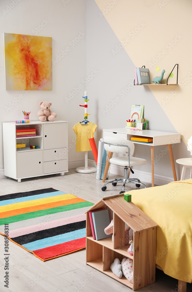 Fototapeta premium Stylish child room interior with comfortable bed and desk