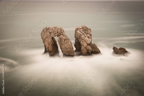 Urros de Liencres. Rocas en el mar Cantabrico photo
